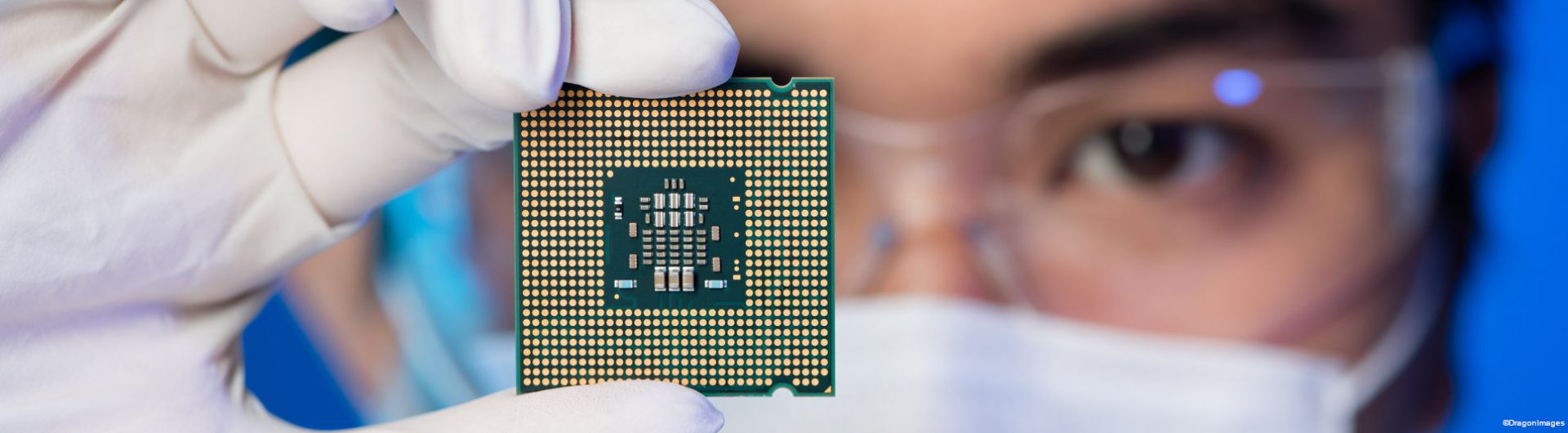 man holding a microchip